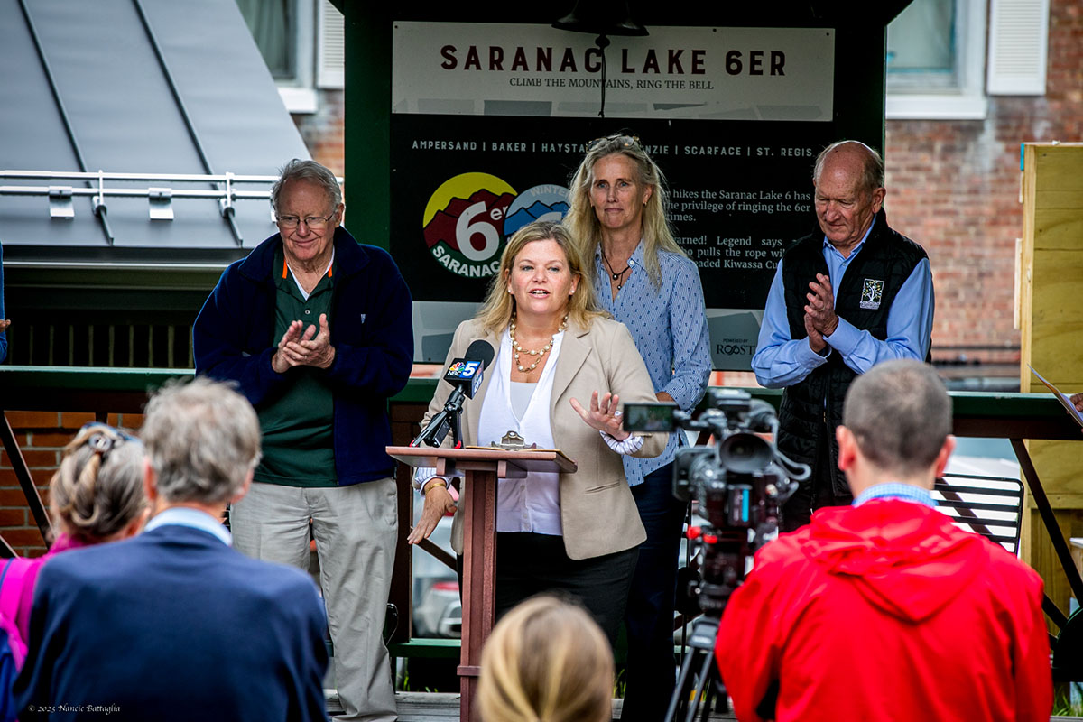 Cali Brooks, Adirondack Foundation president and CEO, announces the Adirondack Small Business Opportunity Fund in Saranac Lake Monday morning. Behind her, left to right, are: Lee Keet, chair of Cloudsplitter Foundation's Board of Trustees; Lori Bellingham, VP of Community Impact for Adirondack Foundation; and Craig Weatherup, of the Weatherup Family Trust. 