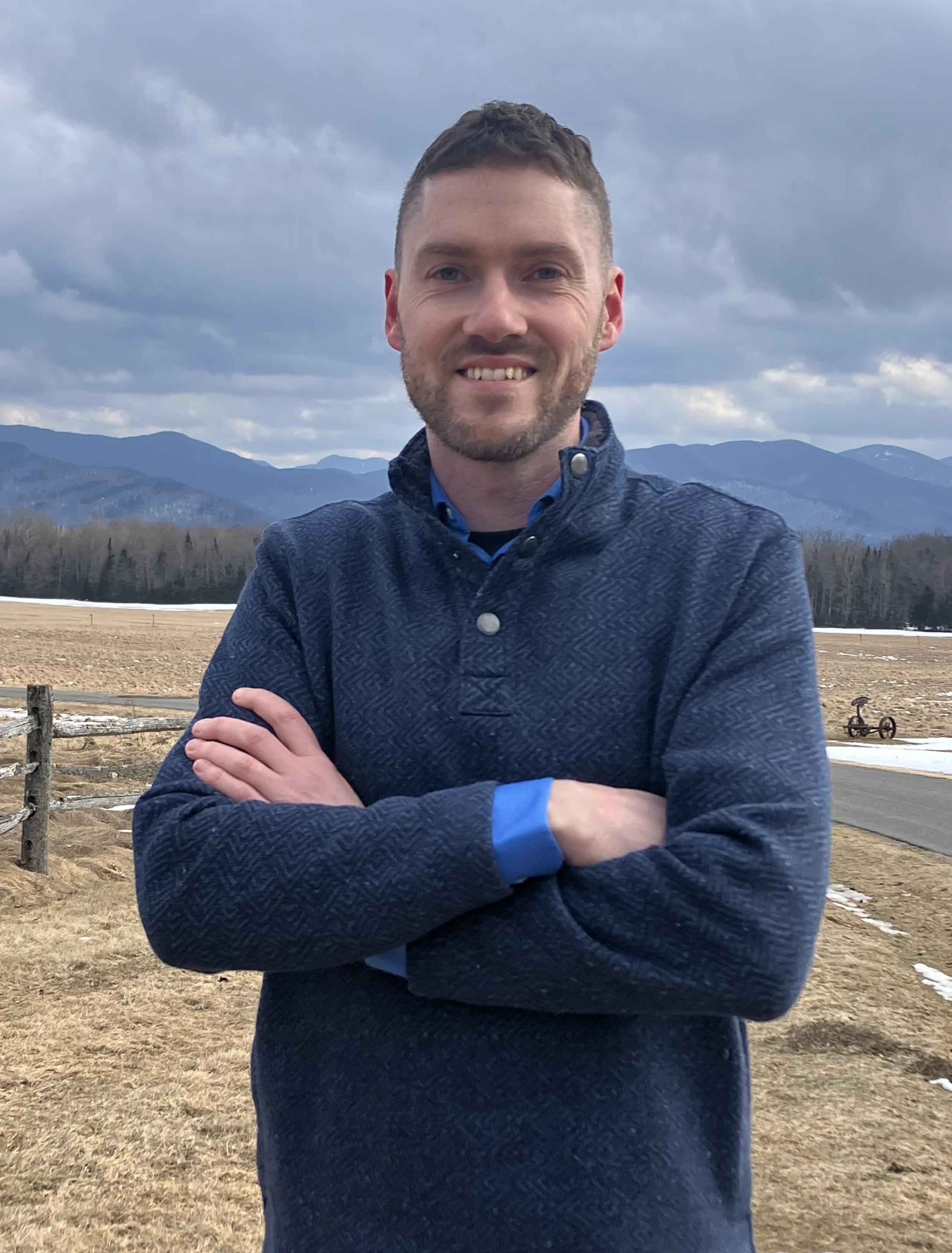 Man standing in front of mountain view